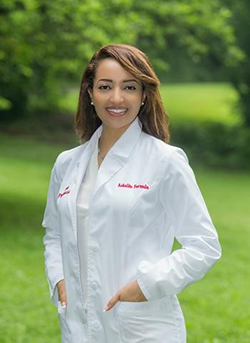 Hiwot Yohannes poses in a lab coat.