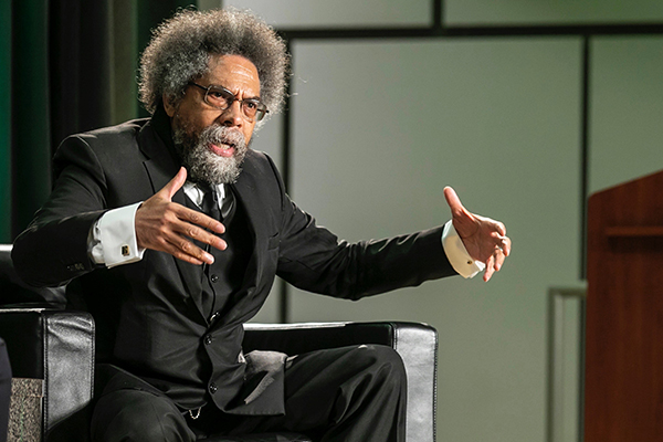 Photo of Cornel West speaking in Mason’s Van Metre Hall auditorium