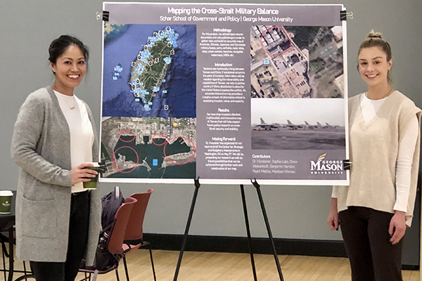 Sophie Lutz, left, and Madison Moreau were part of a team depicting Mapping the Cross-Strait Military Balance.