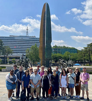 The Schar School delegation poses at the War Museum of Korea during the late May visit.